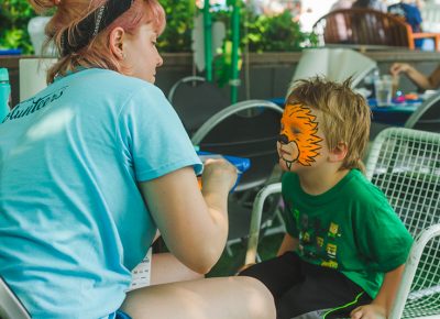 Our volunteer face painters take their work very seriously.