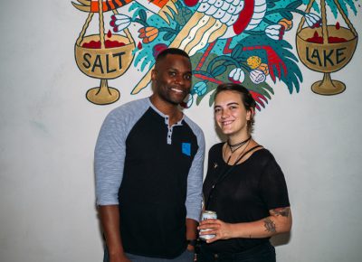 (L-R) Alibi employees Jay Whittaker and Kenzi Anderson were happy to pose in front of Alibi's distinctive mural. Photo: @clancycoop