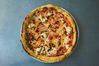 The Milk Run is Fireside’s take on the margherita-style pizza, bringing on ricotta cheese, homemade mozzarella and fresh basil. Photo: Talyn Sherer