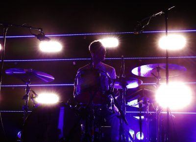 Ryan Winnen drumming in the dark. Photo: @Lmsorenson Photography