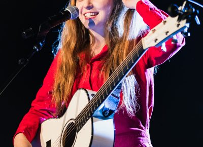 Thanking the crowd for their warm presence and gives a shares a nervous giggle, Jade Bird on stage in SLC. Photo: @Lmsorenson