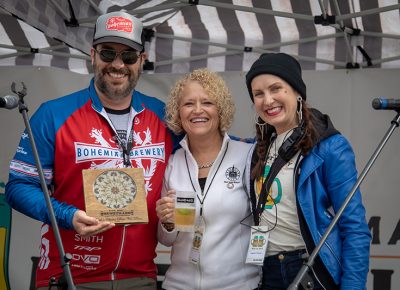 Salt Lake City Mayor Jackie Biskupski and Angela H. Brown awarding Kelly Schaefer of Bohemian Brewery with the Best New Brew and People's Choice: Best New Brew awards. Photo: John Barkiple