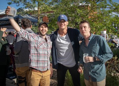 (L-R) Kelly Boyce, Ty Strong and Carson Ewell lucked out with a beautiful day after a cloudy start for Brewstillery. Boyce started drinking when the gates opened, and he’s been here all day. He particularly liked the corn hole in the Game Area. Photo: John Barkiple