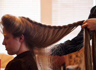 Helen Holm braids Allie Steed's hair in Colorado City, Arizona on December 1, 2012. The two young women had recently left the Fundamentalist Church of Latter-Day Saints.