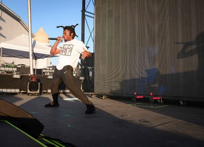 With dreads flying, Denzel Curry pumps up the sold-old out crowd in preparation for headliner Billie Eilish. Photo: Colton Marsala