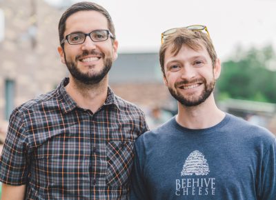 (L-R) Forest Young and Britton Welsh came out to represent Beehive Cheese, one of the many sponsors of the Discover Food Festival. Photo: Talyn Sherer