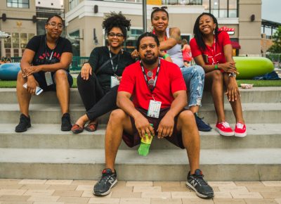 (L–R) Lena Jones, Leah Richardson, Corey Jones, Lakisa Ellis and Angelica Briggschill rest out on the steps before heading back into Tastemakers for a second round of snacks.