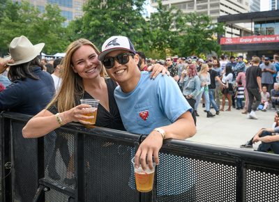 Front-row fans enjoy some local brew.