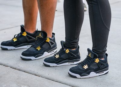 An SLC couple expresses their love for each other while rocking their limited-release Jordan 4 Retro Royalty sneakers.