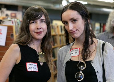 (L–R) Stephanie Leitch and Kylee Hill have both worked as Weller Book Works employees. Hill (2018–19) thinks that her bookstore colleagues are great. Leitch is closing in on her second decade in the store. “I am the person I am today because of the store,” Leitch said. She’s an artist and sculptor, and her mind has expanded due to all the ideas and people she has encountered over the years.