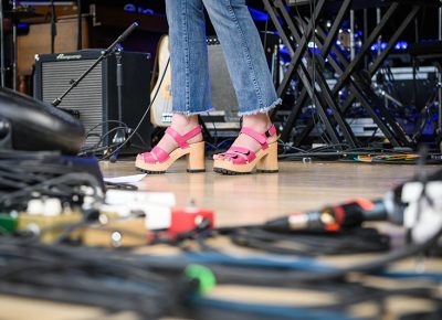 The Hollering Pines kick off their sound check donning stylish high heels