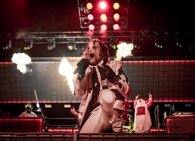 Slipknot lead vocalist Corey Taylor kneels as he roars at Thursday night’s Knotfest Roadshow at the USANA Amphitheatre.