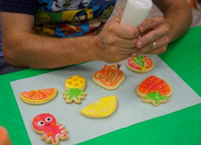 A participant in the Cookie Decoration Workshop creating some wonderful cookies.