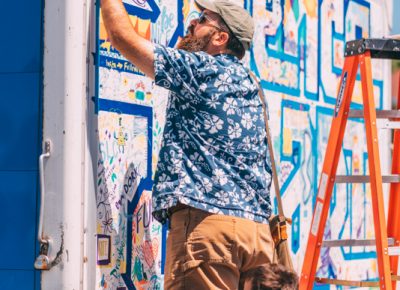 DIY Fest patrons show their love of graffiti and science by tagging a science van.