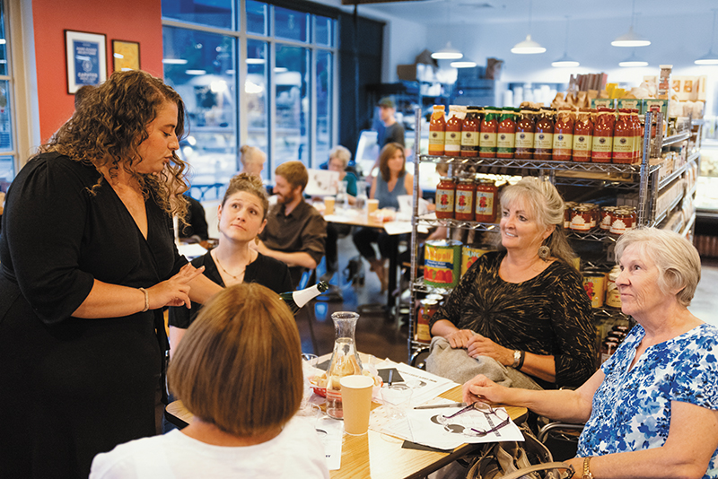 Director of Education and Senior Manager Adri Pachelli (left) curates and directs drinks-and-food pairing classes—including for spirits and wine—among other food-education classes at Caputo’s locations.