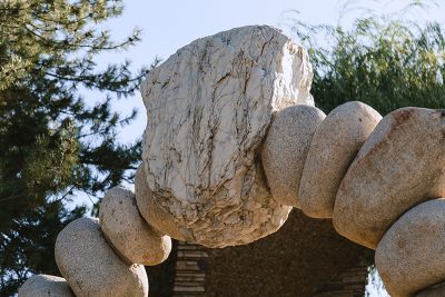 The looming stone archway at the entrance of GIlgal Garden