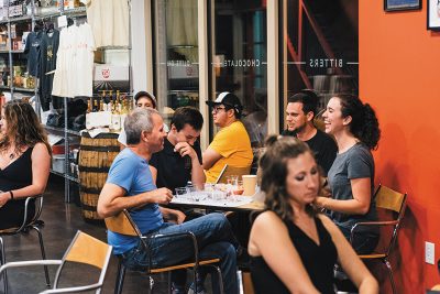 A group of thirsty Caputo's patrons attending a Tasting Class.