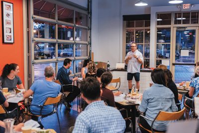 Wine broker Francis Fecteau delivering a wine lecture at one of Caputo's Tasting Classes.