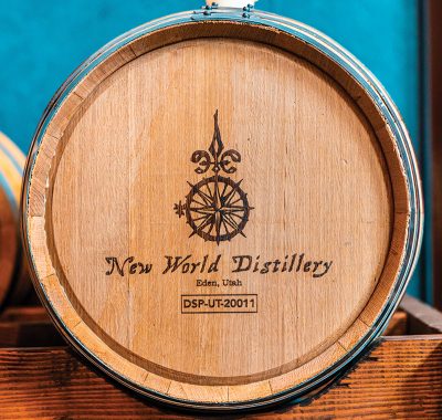 New World Distillery's logo printed on one of their barrels.