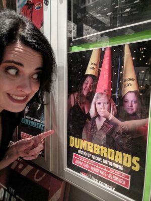 Rothenberg points gleefully at the Dumbbroads poster.