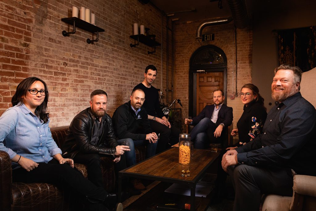 (L–R) Pictured at Black Feather Whiskey, Roberta Reichgelt, Peter Makowski, Ben Kolendar, Jacob Maxwell, Andrew Wittenberg, Simone Butler and Will Wright comprise the Business Development Division of SLC’s Department of Economic Development.