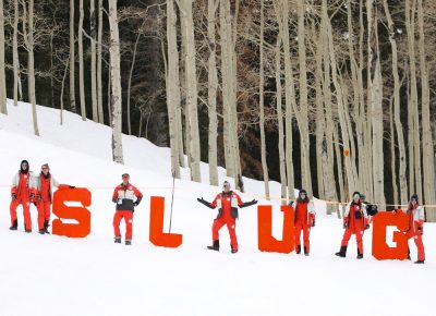 SLUG Team strikes some poses at the top of the hill with the S L U G Letters at the SLUG 20th Anniversary Meltdown Games at Brighton Resort.