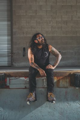 “My dad had us grow up in L.A. And at that time in the late '80s, he was really into metal, just like Sabbath, Blue Oyster Cult and stuff like that,” says Guzman. “So I always grew up in this weird little metal [music] household. And then all of a sudden, when I grew older, I was like, 'Oh, I've got to cut my hair and be part of society.' And I thought, No, fuck that.”