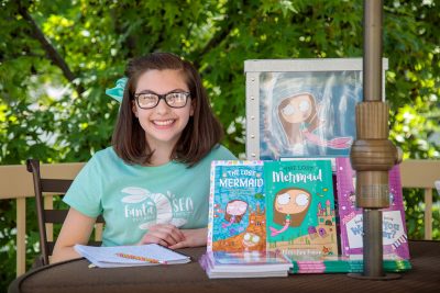 Mary Ann Jensen, pictured here with her literary creations.