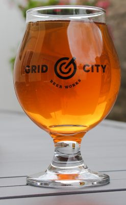 Upon pouring Grid City's Honey Cream Ale, "a layer of off-white foam quickly clutches to the edges of the glass, forming a ring that sticks around."
