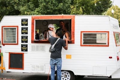 The EMBROGO crew helps out a curious patron. Photo: Erin Sleater