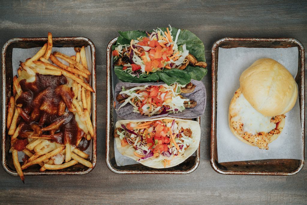 (L-R) Diversion Eatery's Poutine Fries, Taco Mix and Parma Pollo exhibit the large range of menu items the restaurant has to offer.