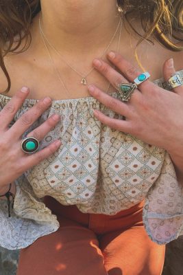 "I really like Southwestern, cowboy chic, boho," says Love. "A lot of my jewelry is influenced by the desert, so I do a lot of desert-inspired pieces, like the Delicate Arch necklace, the Monument Valley necklace. I have a Goblin Valley bracelet. I just like to do landscapes."