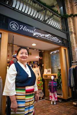 Yeshi Shekhand in front of her Himalayan Arts shop.