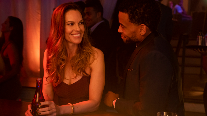 Still from Fatale (movie) of Hilary Swank and Michael Ealy.