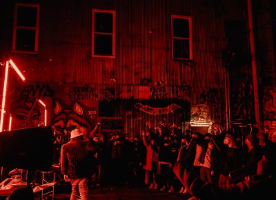 The crowd surrounds Younga$$ Nico at FICE Gallery in SLC.