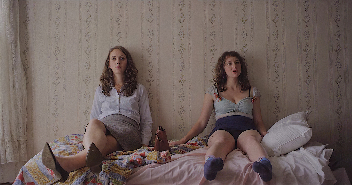 Our Father is a sardonically morose yet whimsically charming new film that rests on the shoulders of four women: sisters Beta and Zelda. (L–R) Baize Buzan as Beta and Allison Torem as Zelda.