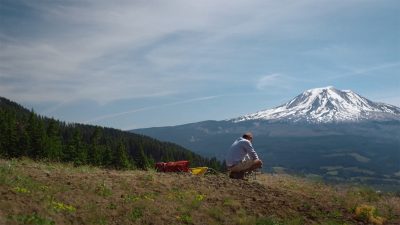 The Dark Divide chronicles the true journey of Robert Michael Pyle who dove into Bigfoot country after his wife's passing.