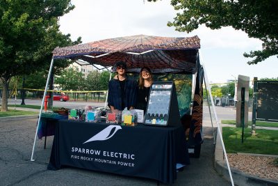 Sparrow Electric showing off their booth at the SLUG Picnic.