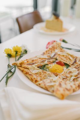 The breakfast version of Dali Crepes' Montenegro has prosciutto, arugula, cheese and a runny egg yolk.