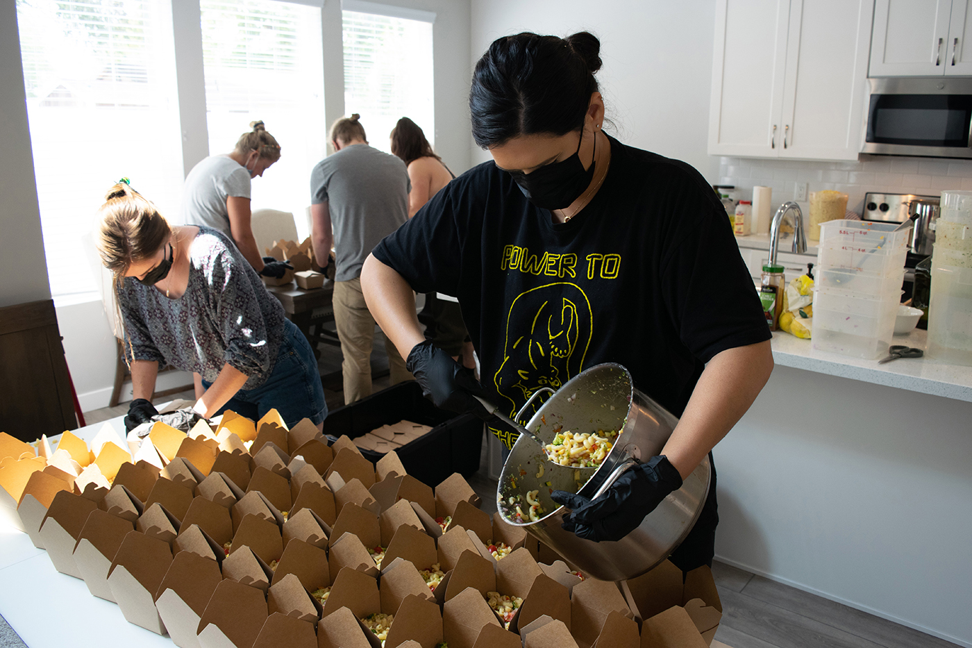 Food Justice Coalition Founder Jeanette Padilla and FJC volunteers prepare plant-based meals for unsheltered citizens of SLC.