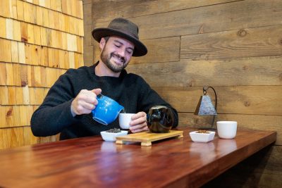 The Tea Grotto owner Bradley Heller serves up a cup of the shop's specialty tea.
