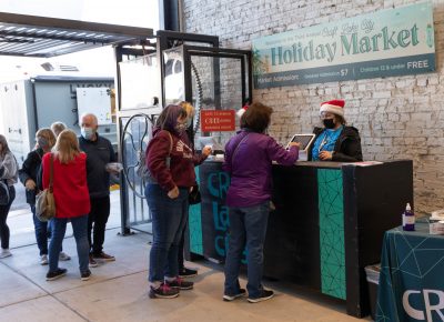 The ticket line grows as patrons enter the Holiday Market.