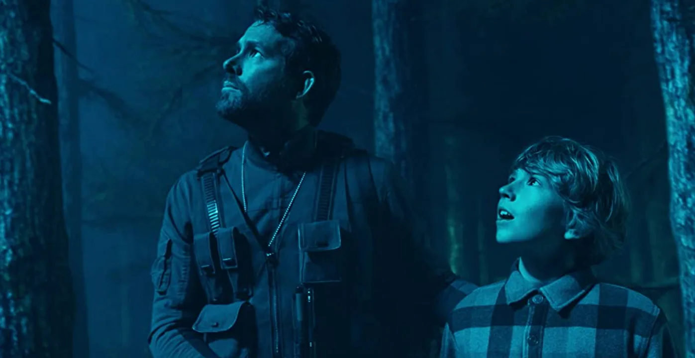 Still of Ryan Reynolds and Walker Scobell in The Adam Project