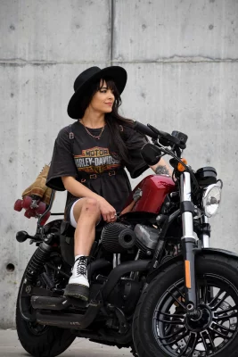 Cintia Lastra sitting on a Harley Davidson.