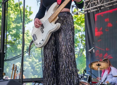 Avery Davis playing her bass guitar.