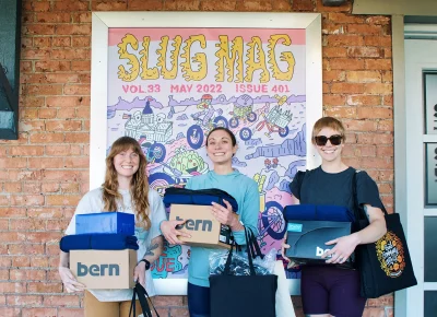 Women’s winners in front of SLUG Mag’s May issue banner! (L–R): India Alfonso (1st Place), Aubrey Larsen (2nd Place) and Madison Steele (3rd Place).