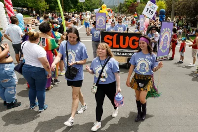 (L–R): SLUG friends Parker Mortensen, Lexi Kiedaisch and Kelly Fernandez finishing out the parade with a smile and unforgettable memories.