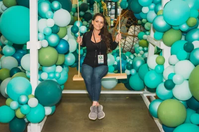 Courtney Call sits in a Craft Lake City centerpiece, a balloon garden(?). Whatever it is called, it is neat. (Photo: @clancycoop)