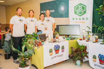 (L-R) Quino Fernandez, Eric Lo, Aria Conran and Jesse Montgomery of KRADO demonstrate technology-based smart plant monitoring, along with a plant cutting giveaways. (Photo: @clancycoop)