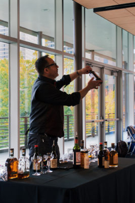 Jimmy showcasing all the different types of whiskey that the attendees are experiencing. Photo: Lexi Kiedaisch